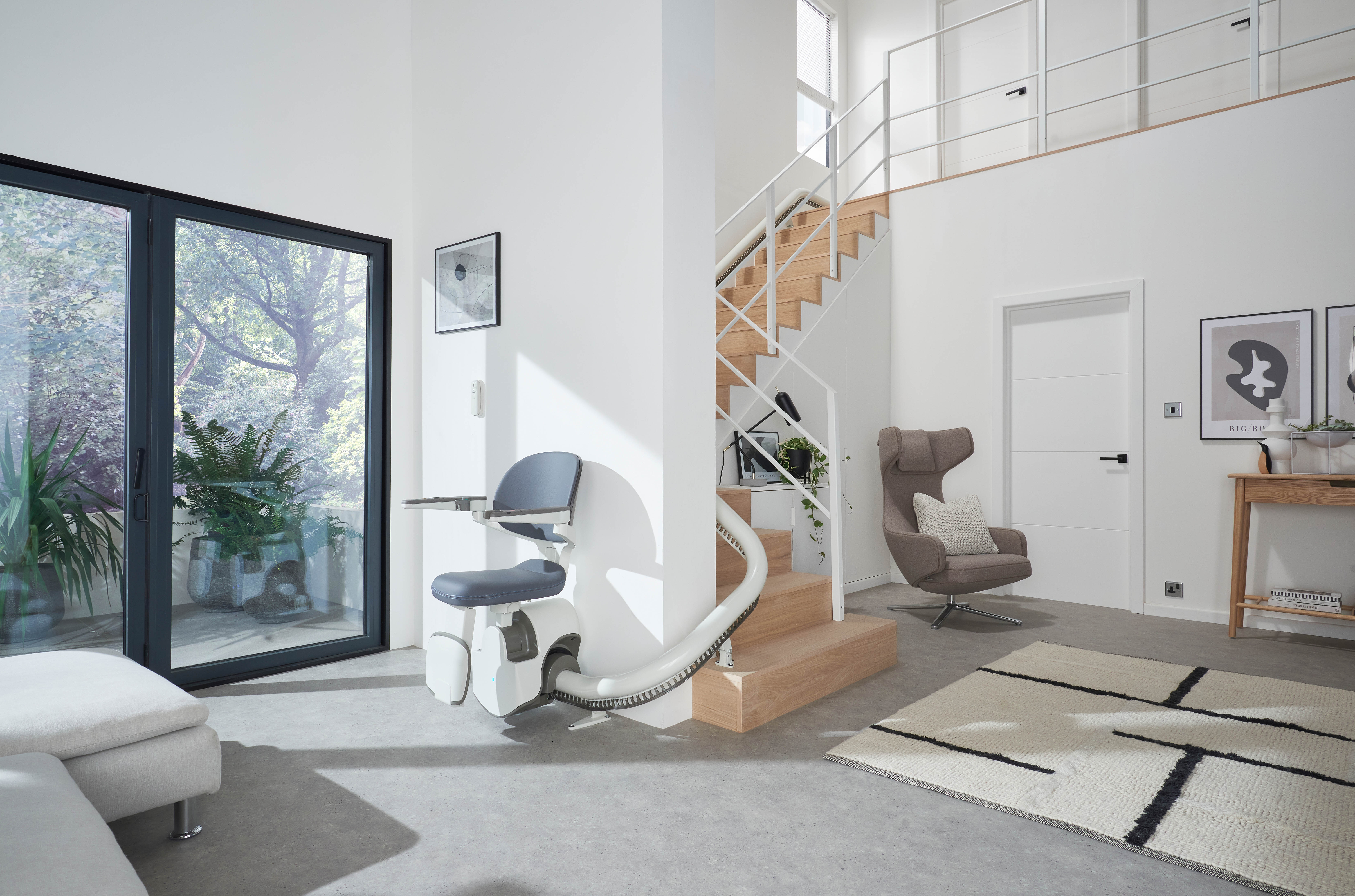 Flow X stairlift on a curved staircase